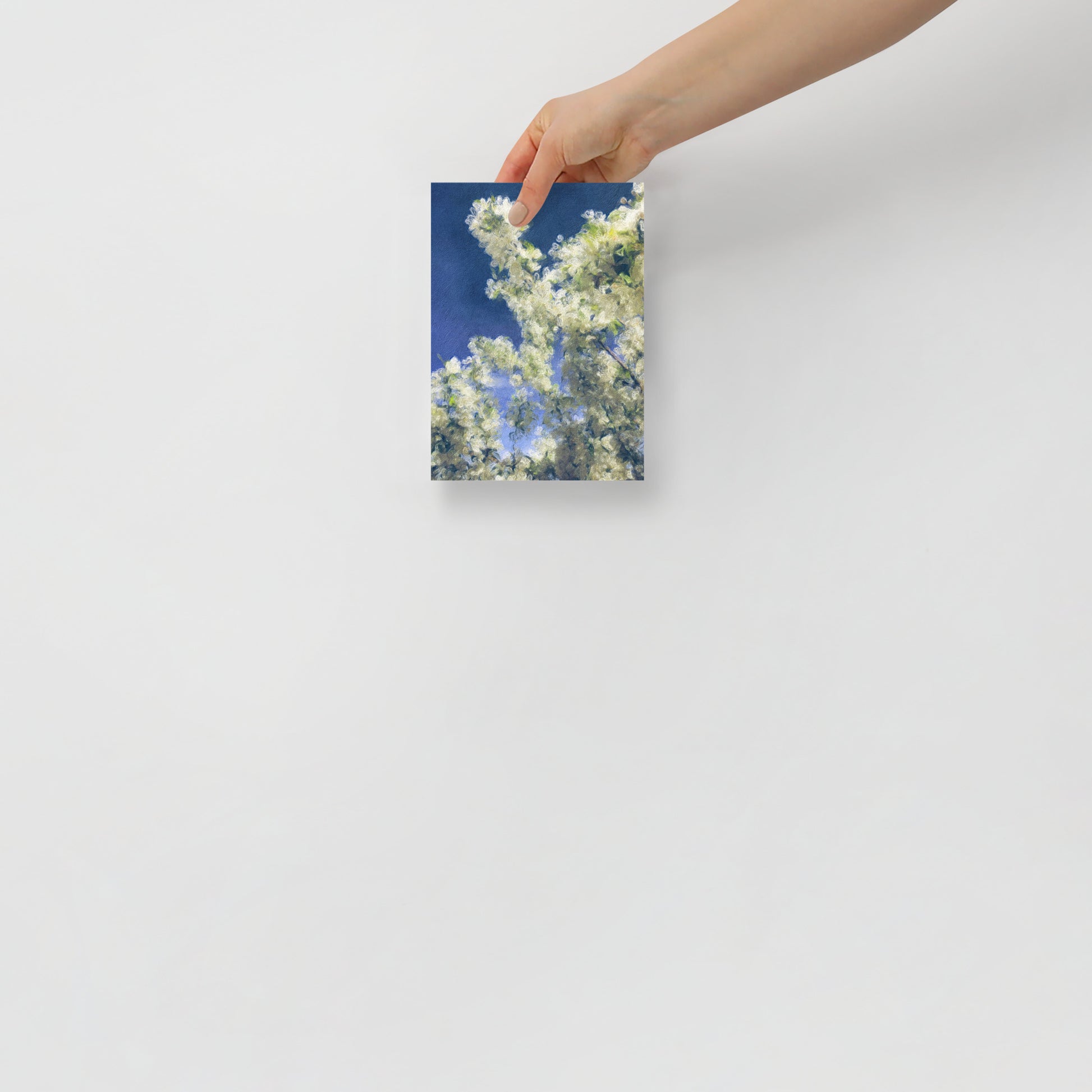Blooming Sky floral art print with bright tree blossoms and blue sky backdrop, for a home office for a cheerful atmosphere.