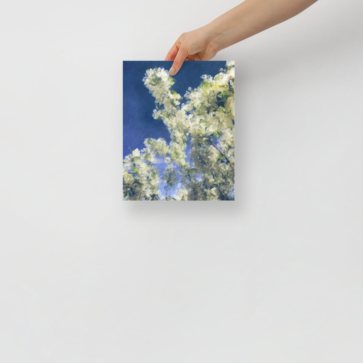 Flowering art print, Blooming Sky, adds warmth and color to a cozy bedroom with nature-inspired decor.