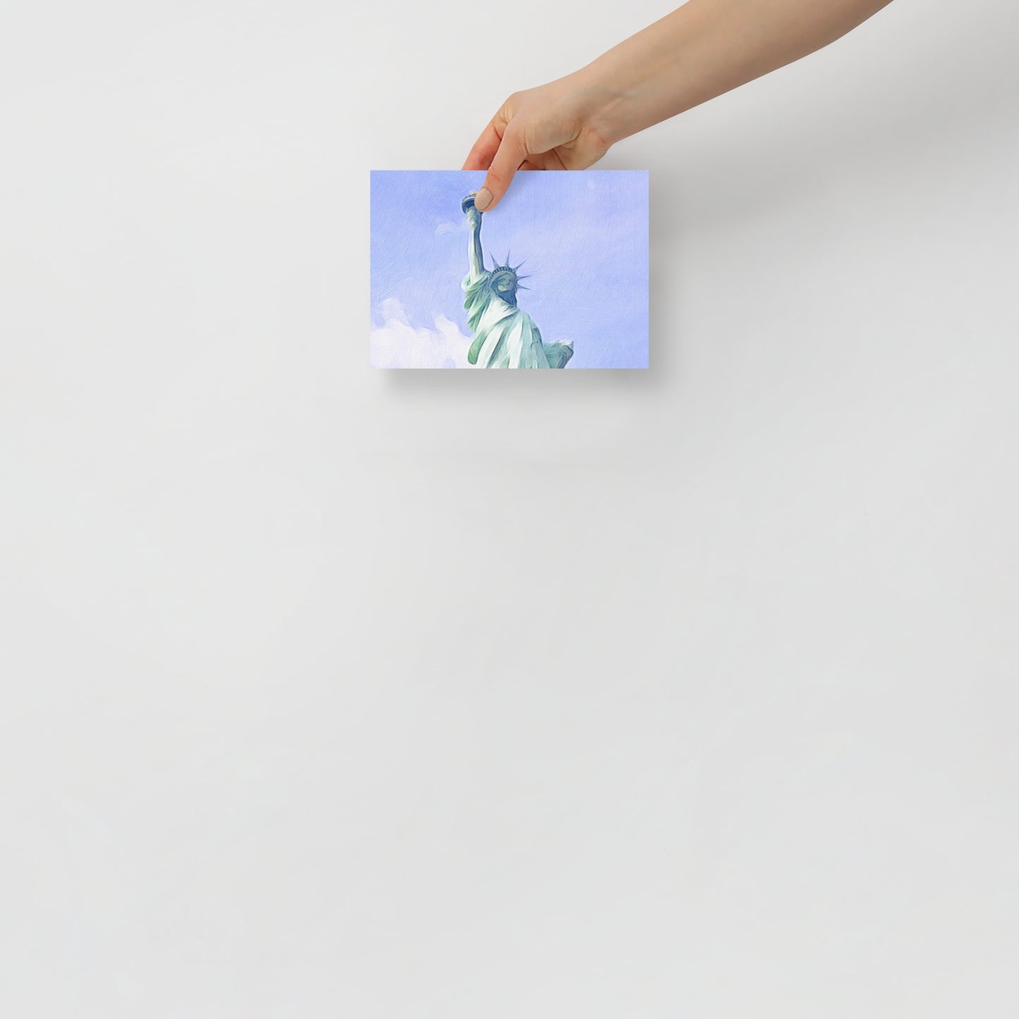 I Lift My Lamp patriotic print with the Statue of Liberty’s iconic torch, displayed in a serene bedroom for a thoughtful touch.