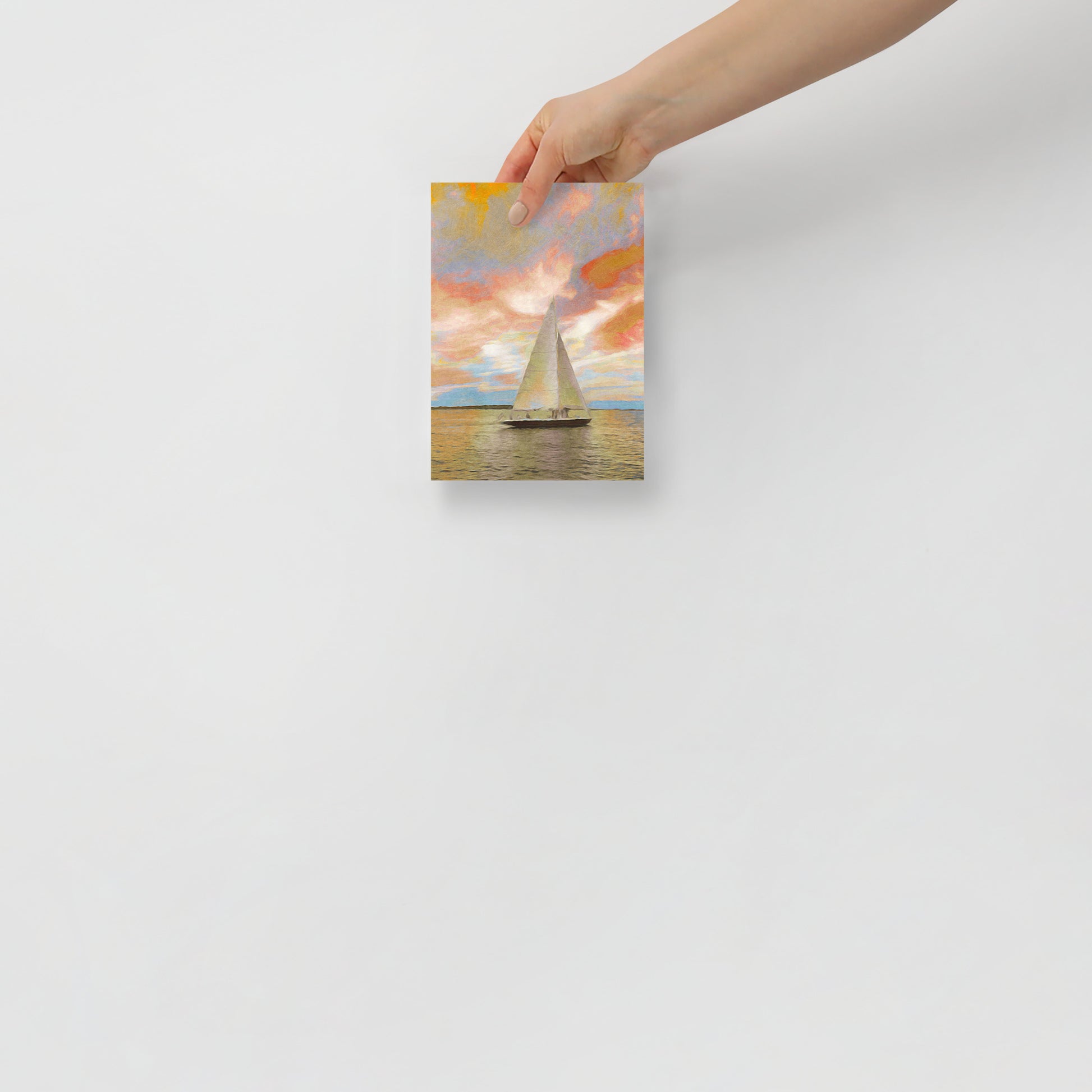 Sailing Through the Fiery Sky coastal landscape print with intense sunset hues, displayed in a contemporary home office for a bold statement.